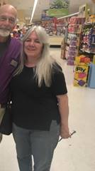 A person standing in front of a store